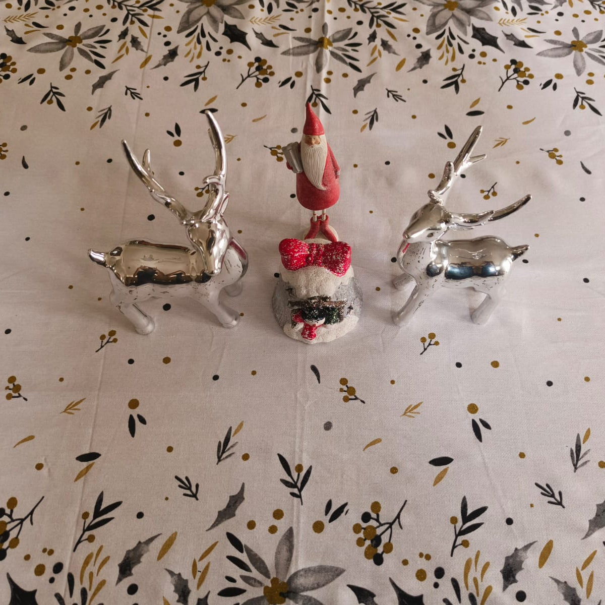 Decorative Christmas ornaments on a patterned fabric background