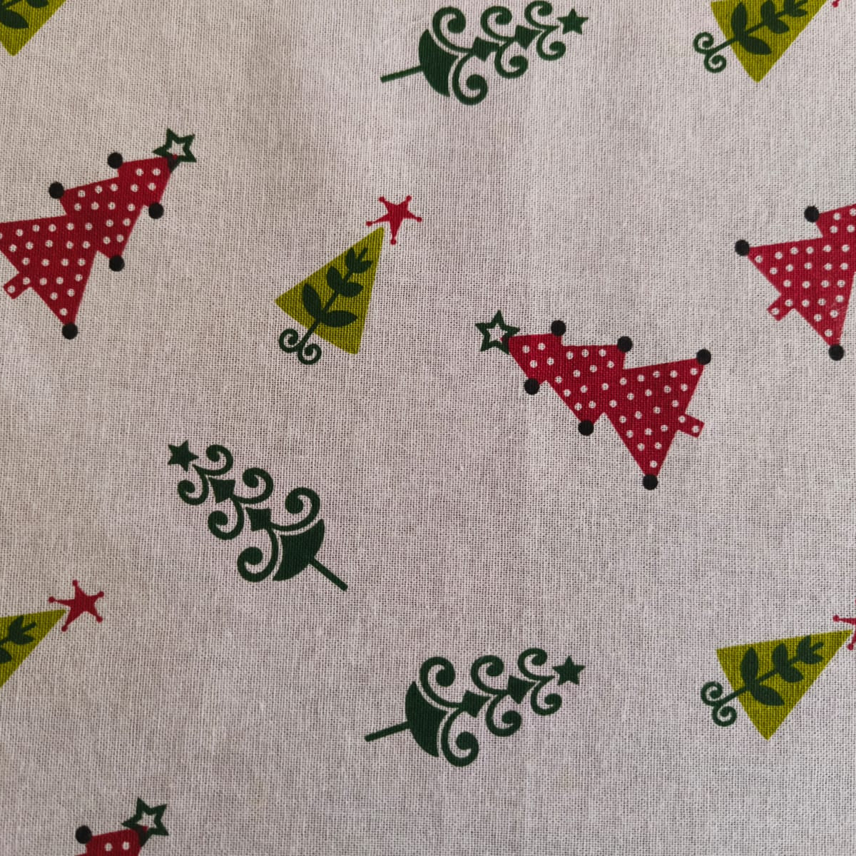 Fabric with Christmas tree pattern on a beige background